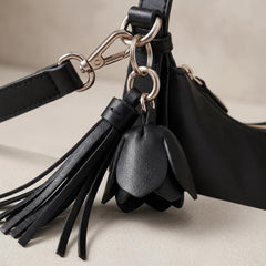 Rosvovo Women's Crescent Shoulder Bag - Vegan Leather Crossbody Handbag with Flower Charm & Tassels