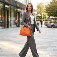 Rosvovo Tassel Hobo Handbag for Women, Elegant Vegan Leather Crossbody Bag with Adjustable Shoulder Strap, Orange